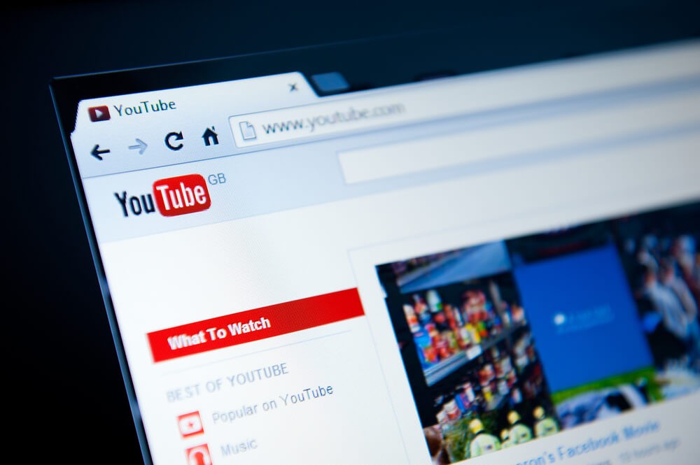Closeup of YouTube search and home page.