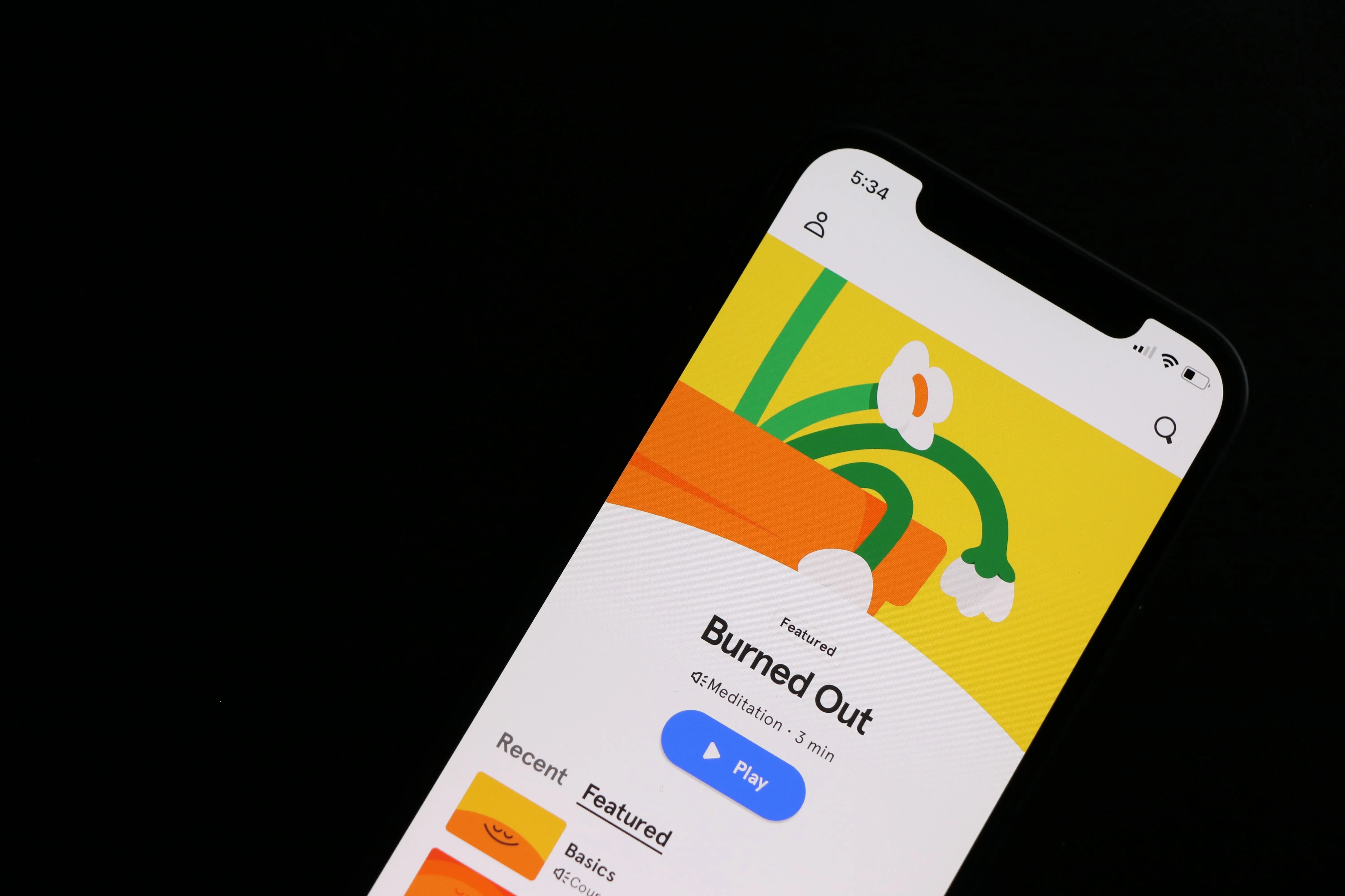 App on a phone showing a meditation program for burnout